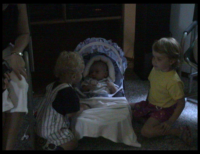 Conner and Justine playing with Logan 