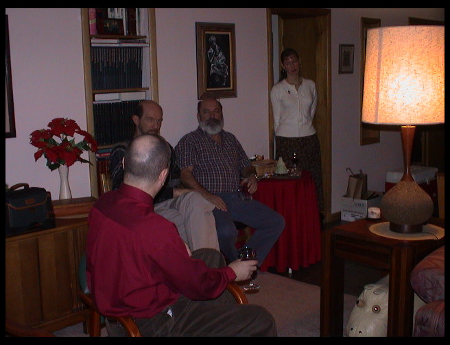 Henry, Carl, and Grandpa Rick engaged in pre-dinner conversation.