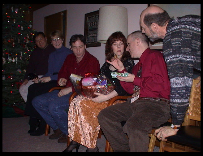 Everyon trying to decide if they should steal a present or open a new one.