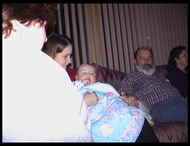 Sandra, Auntie Heather holding Logan, Grandpa Rick, and Grandma Zoe Ann.