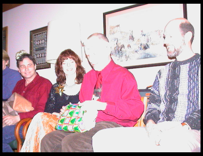 He sure takes his time opening gifts.