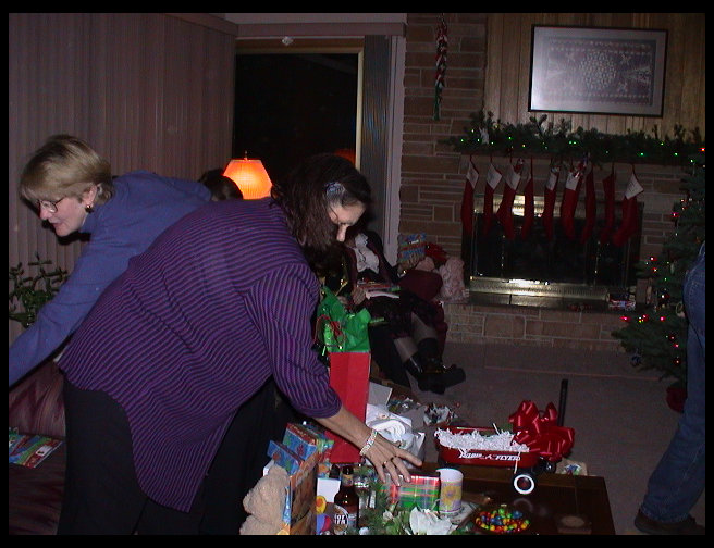 Grandma Zoe and Kate handing out presents.