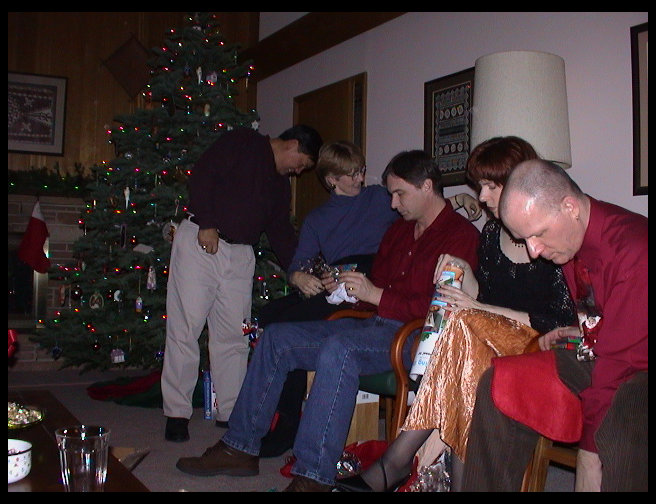 L to Rt: Greg, Kate, Dave, Jennifer and Henry opening stocking stuff.