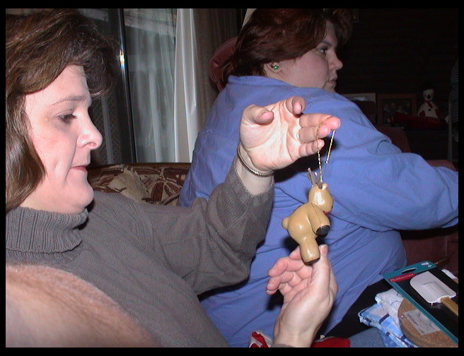 Aunt Kari and Sandra opening stocking stuff.