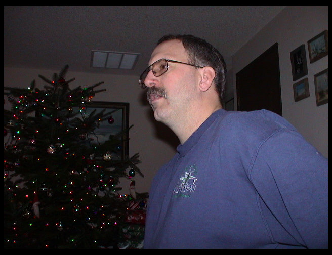 Uncle Ron looking at what one of his kids got.