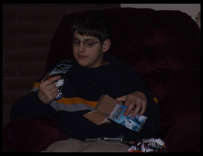 Tyler opening one of his stocking stuffers.