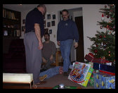 Grandpa, Uncle Dave, Uncle Ron and Kaleb putting stocking stuff away.