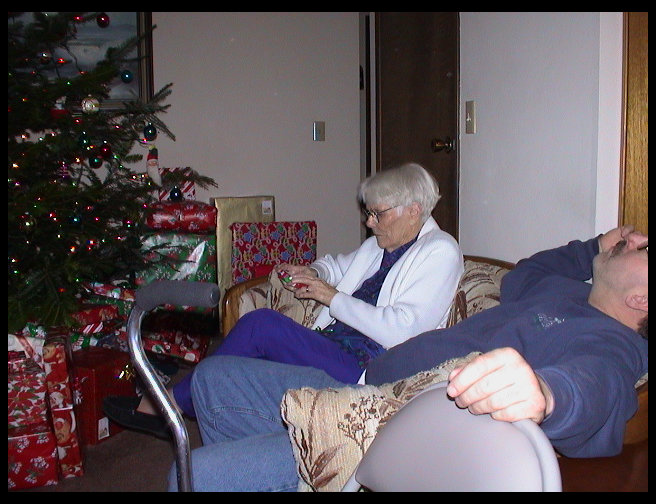 Nonnie and Uncle Ron opening gifts.