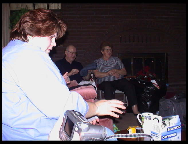 Sandra, Grandpa and Grandma Trogdon enjoying Christmas.