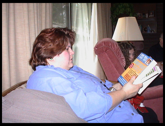 Sandra opening a gift from Timm.