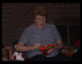 Grandma is opening a present.