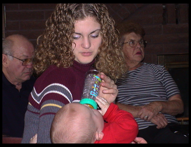 Jennifer feeding Logan.