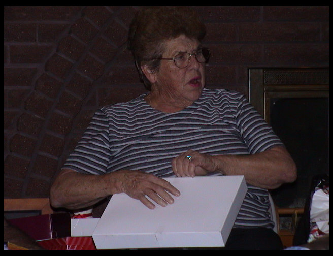 Grandma opening a gift.