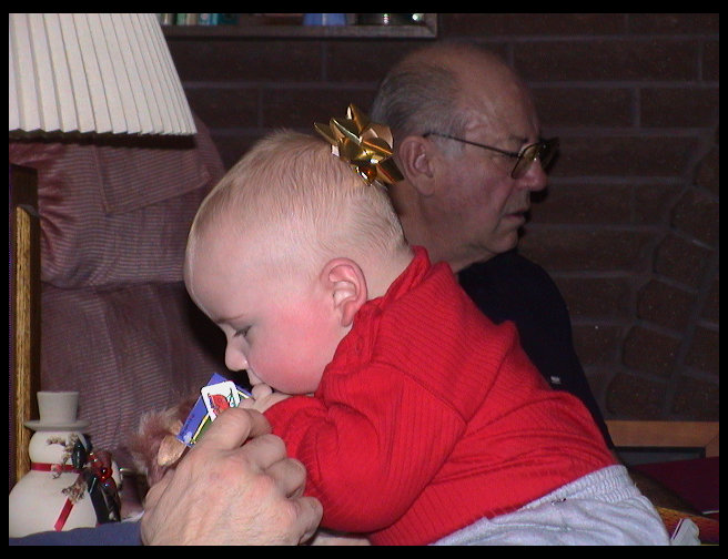 Logan eating Uncle Ron's gift.