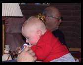 Logan eating Uncle Ron's gift.