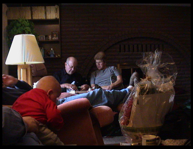 Grandpa opening a gift.