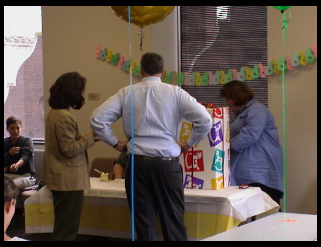 Kathy, Peter and Sandra opening Peter and Kathy's gift.