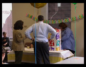 Kathy, Peter and Sandra opening Peter and Kathy's gift.