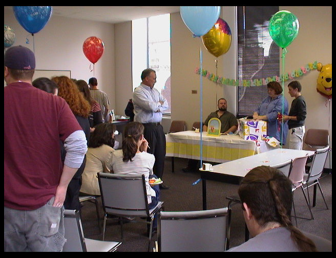 Peter waits for me to get the present open.