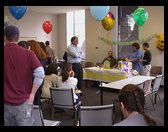Peter waits for me to get the present open.