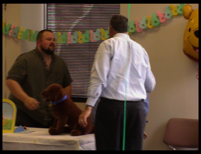 Peter hugging the proud mom to be.