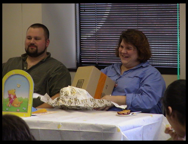 Still opening baby gifts...Timm hopes there are cigars for him.