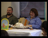 Still opening baby gifts...Timm hopes there are cigars for him.