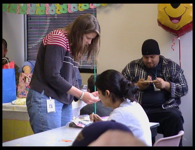 Sarah Hastings standing, David Lee in hat and Probjaht Basi in white.