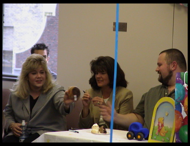 Jess and Kathy looking at something, not sure what though.