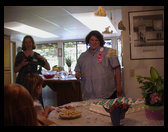 Kristi Ross and Sandra Gleason looking at teh cake.