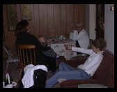 Jennifer Trogdon on couch, Sandra holding Logan and Nonnie in white.