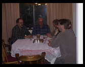 Ron, Dad, Michael and David engaging in after dinner conversation.