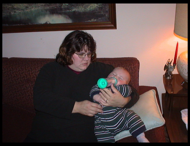 Mommy giving Logan his dinner.
