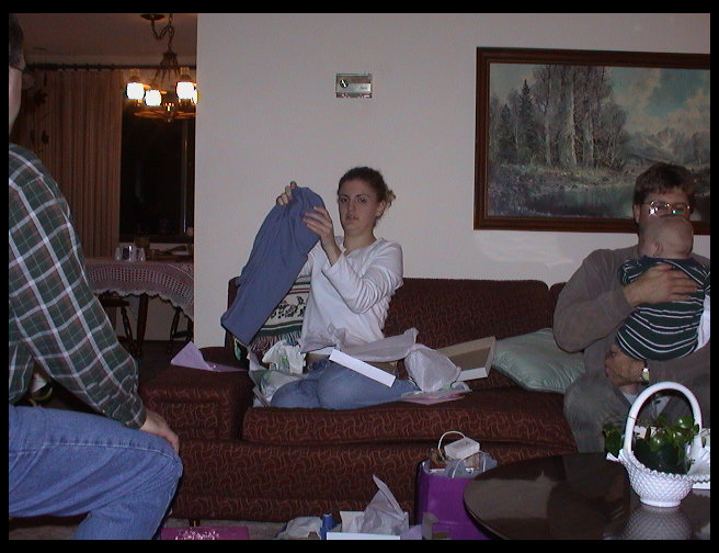Jen folding her goods up. Uncle David still holding Logan.