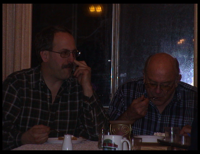 Ron and Dad eating pie.