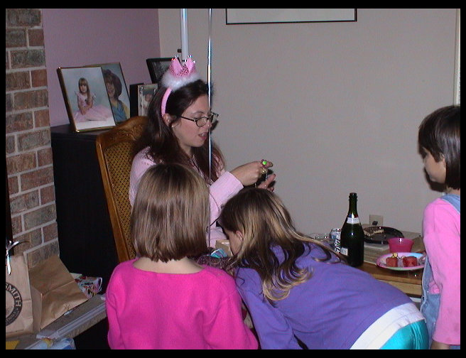 The birthday girl reading her card.