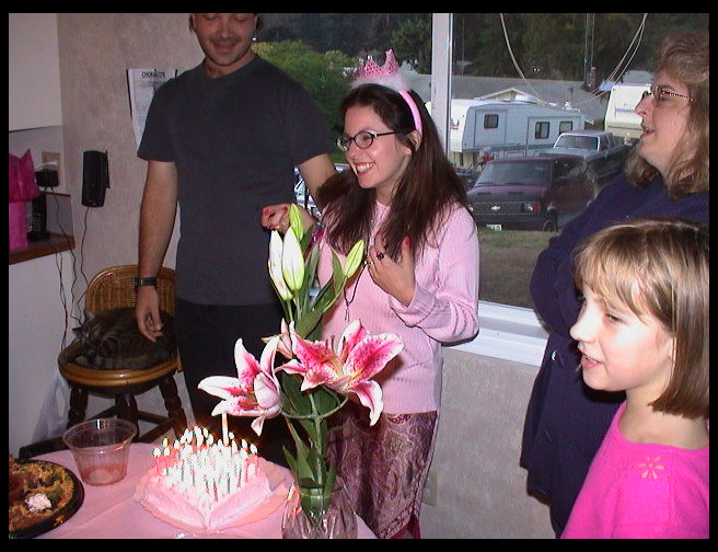 Juliet preparing to blow out the cake.