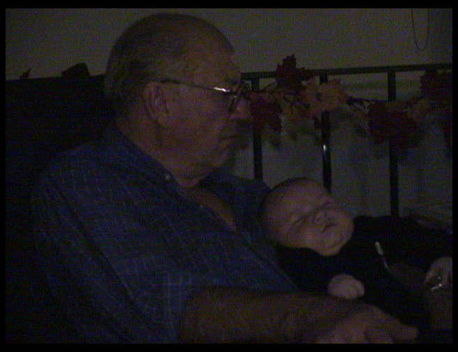 Grandpa Trogdon and Logan sharing a nap.
