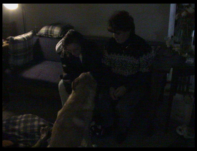 Beth McKennon and Monica Mustard petting Maya.