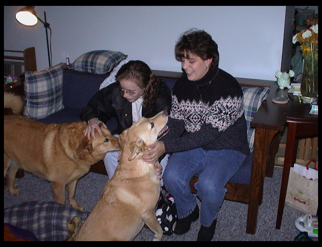 Beth petting Baja and Monica getting love from Maya.