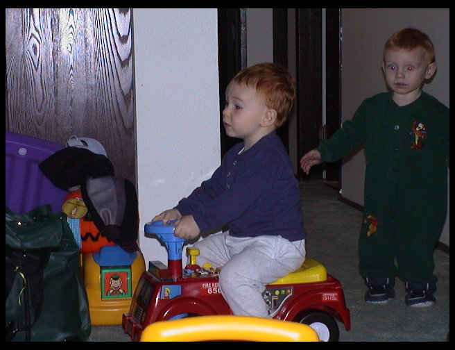 Walter Ross on the fire engine and Jared Watson standing up.