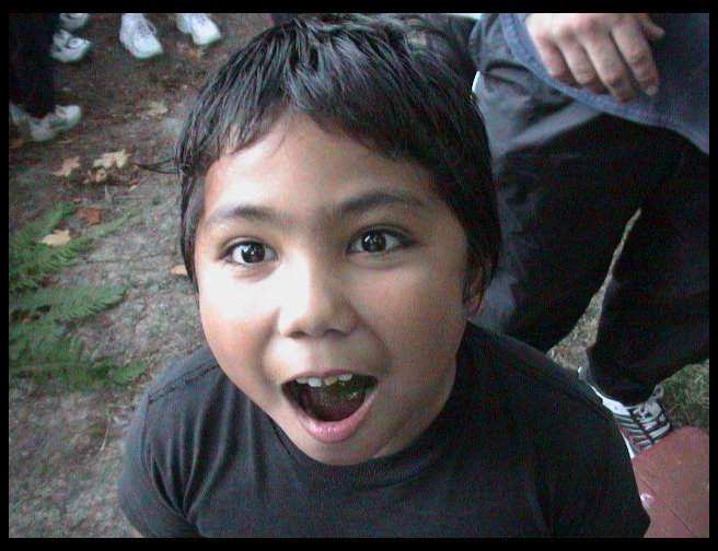 Mr. Borgonia examines my camera