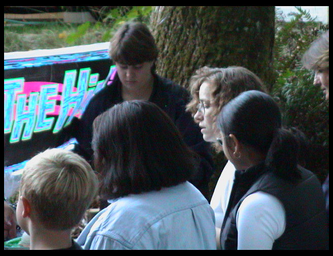 Mrs. Mustard and Ms. McKennon serve cake