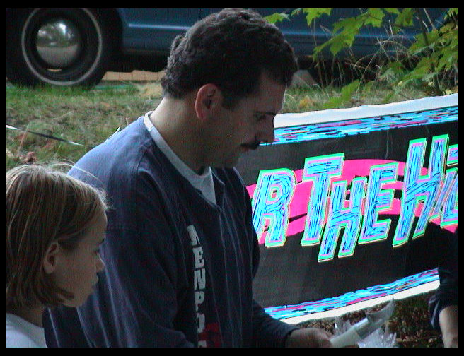 Mr. Mustard also helps serve cake