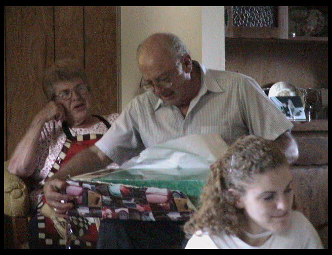 Grandpa opens his gifts