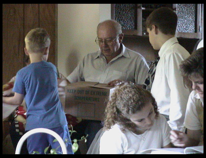 Grandpa opens his gifts