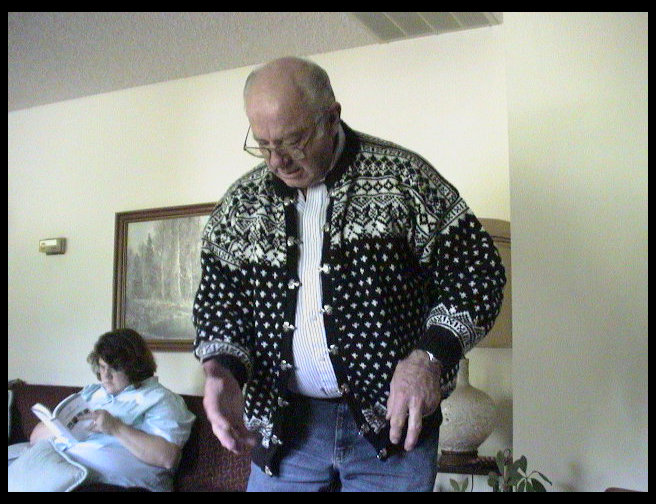 Grandpa tries on his sweater