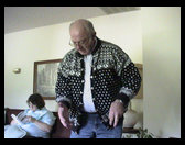 Grandpa tries on his sweater