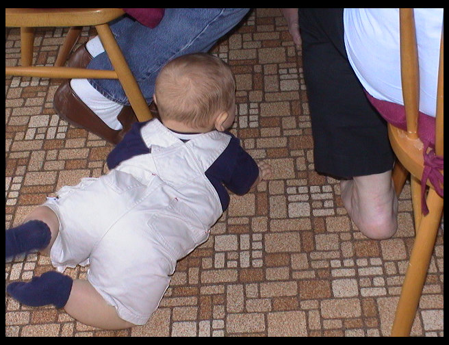 Crawling under the table.
