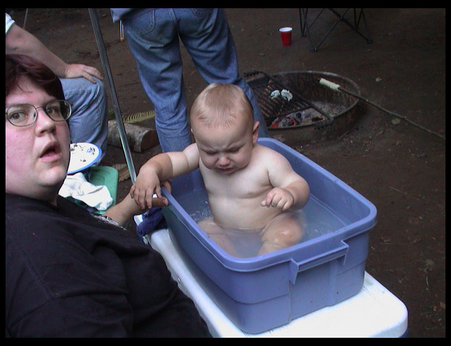 Logan getting a bath in the great outdoors.